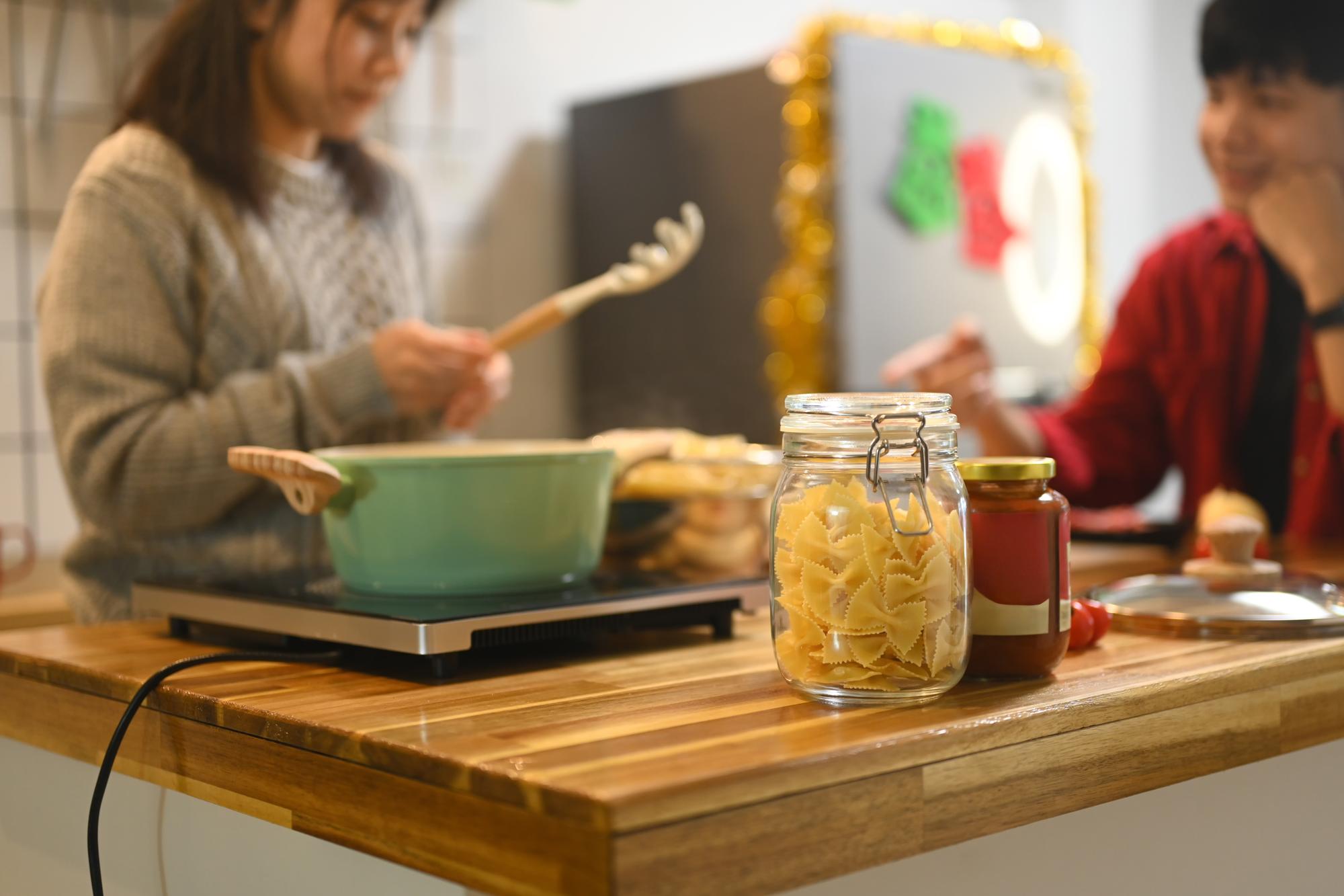 Studio kitchen with jars, recipe notes and utensils